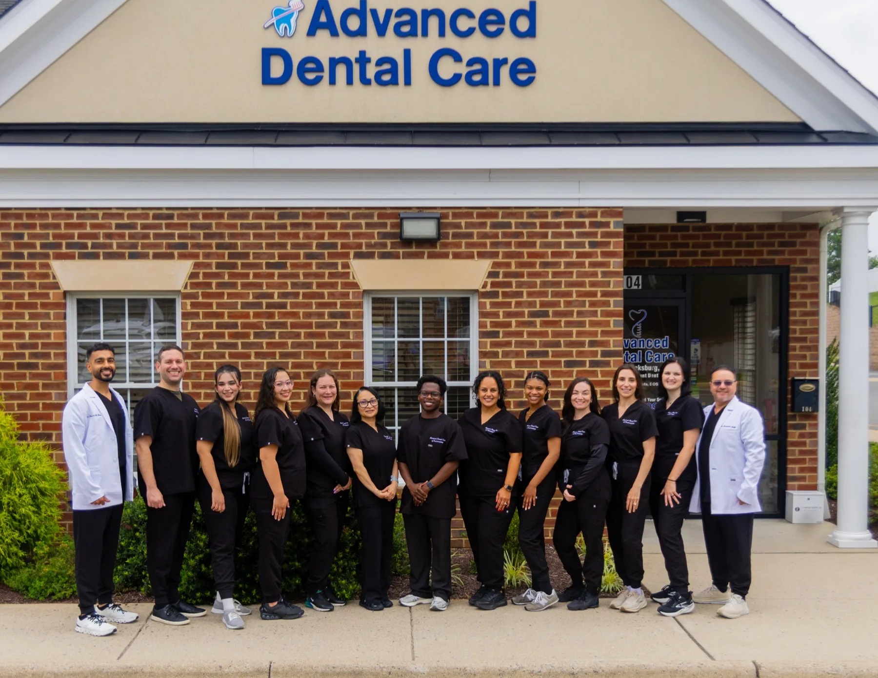 The full team of Advanced Dental Care of Fredericksburg outside the office